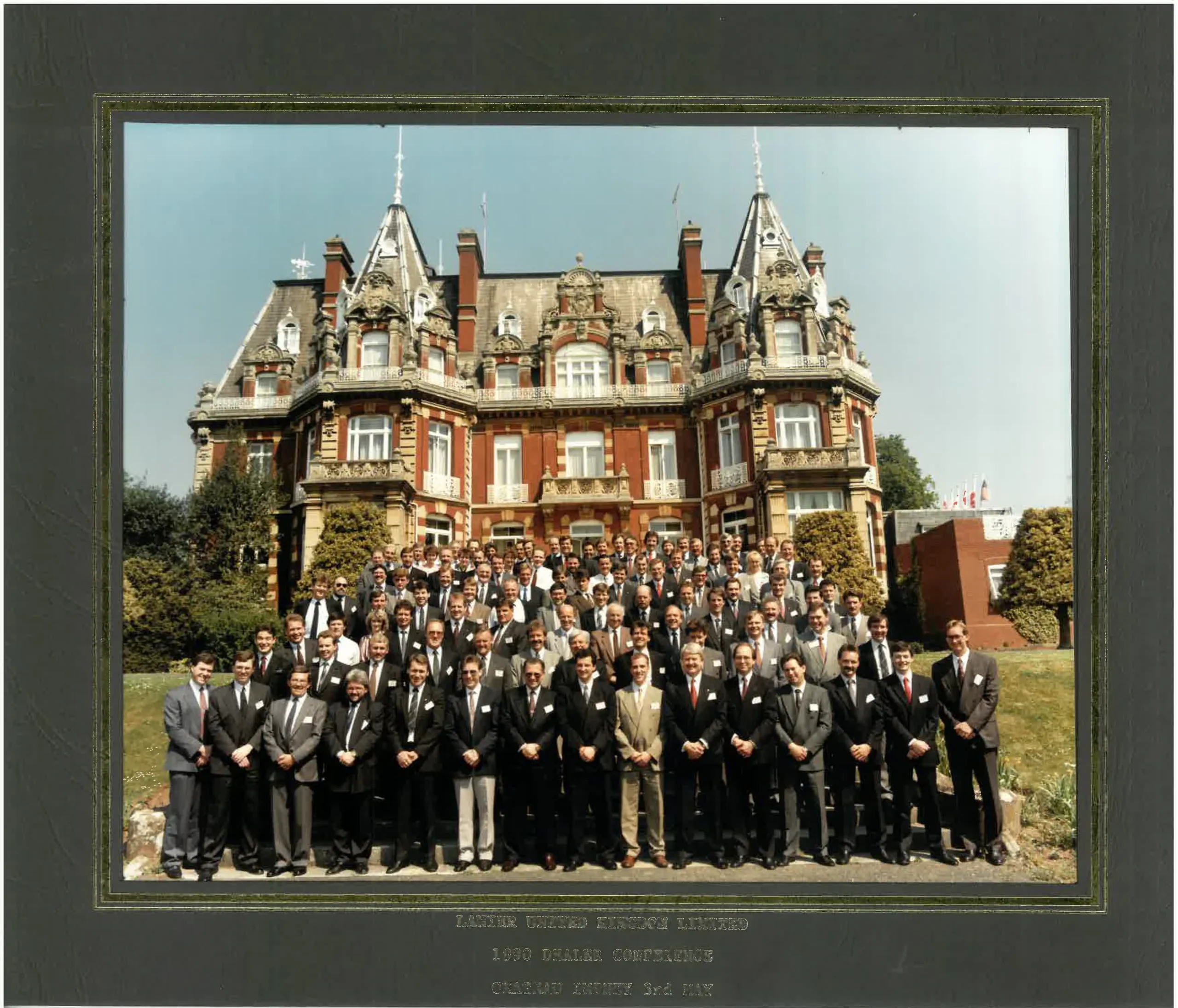 Lanier Dealership Conference May 3rd 2023 Group photo from the 1990 Lanier Dealer Conference at Chateau Impney, featuring Mastercopy and other UK dealers, with the historic French-style chateau in the background.